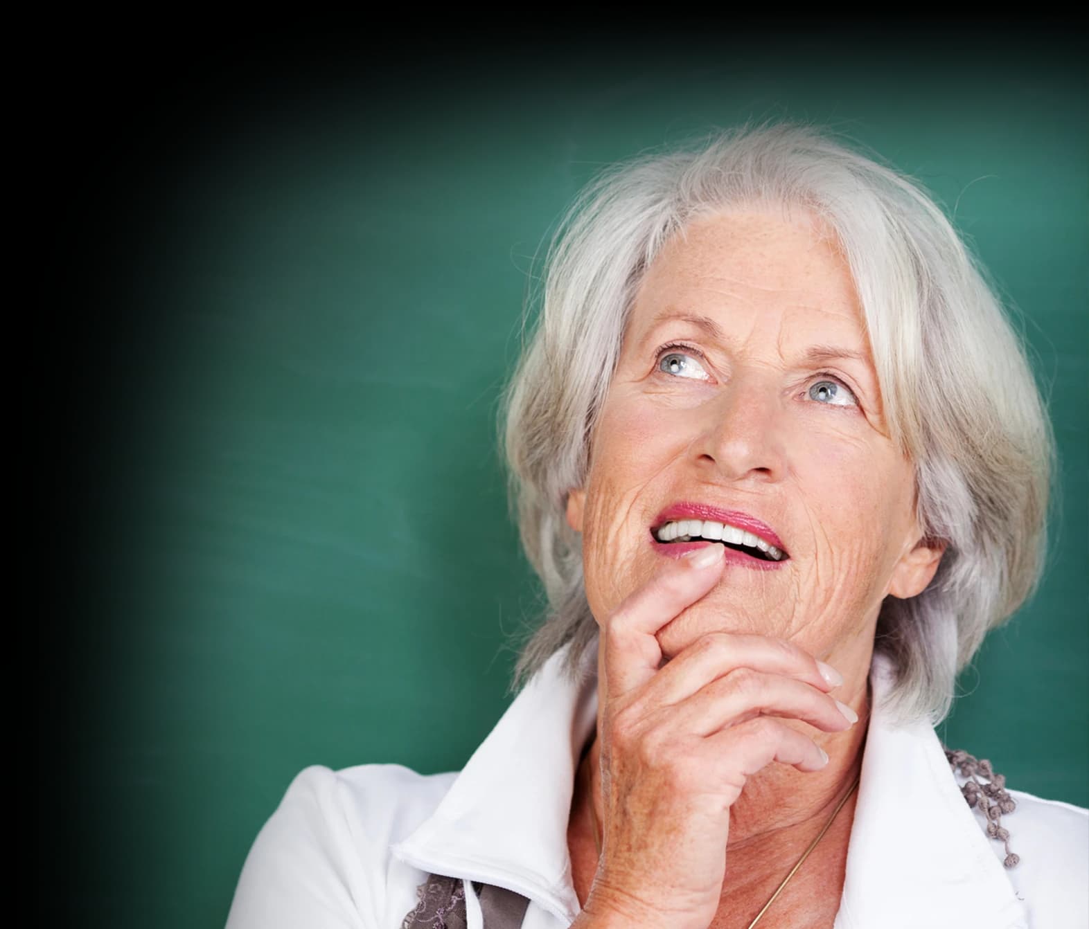 Senior woman standing thinking