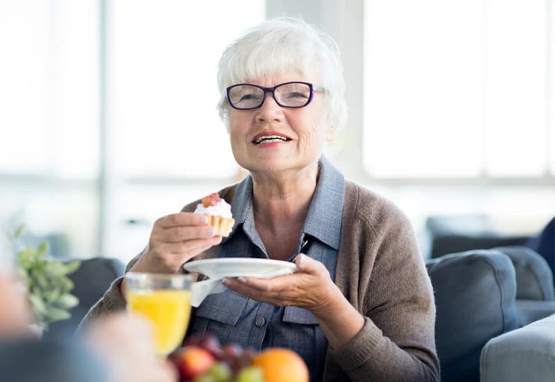 Senior woman enjoying dessert