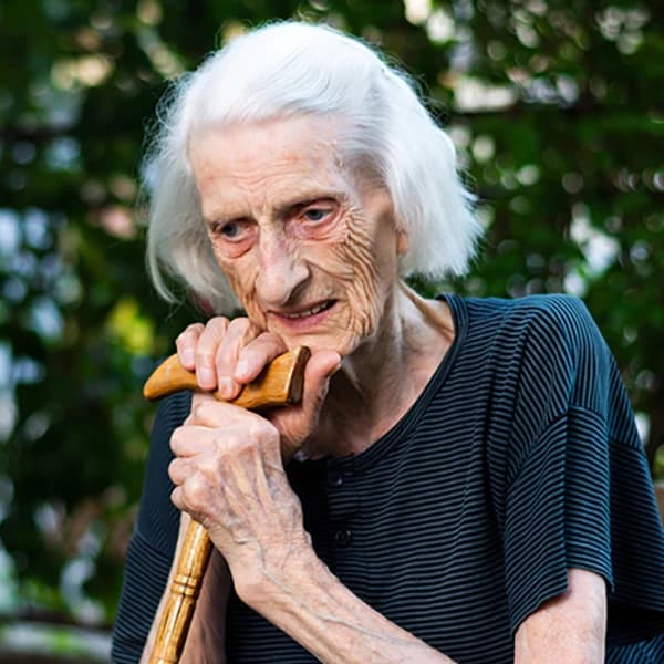 Senior woman with a walking cane
