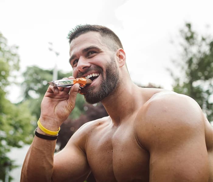 Man eating energy bar