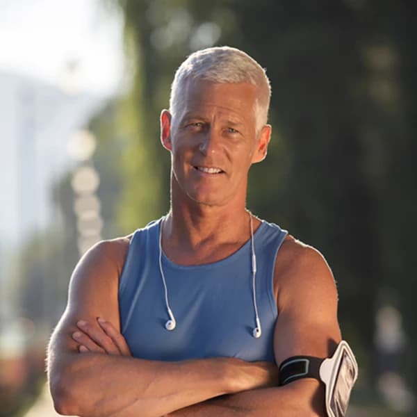 Handsome senior jogging man