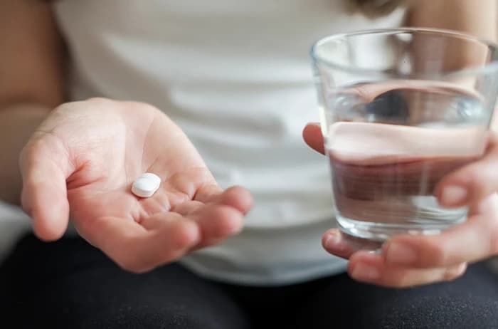 Woman taking supplements
