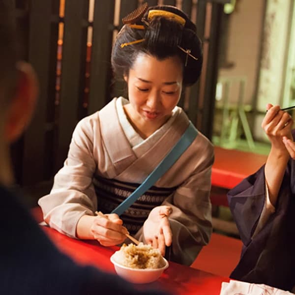 Japanese woman eating in Kimono