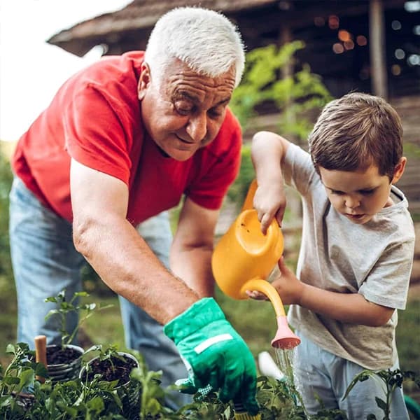 Grandfather and grandson in garden